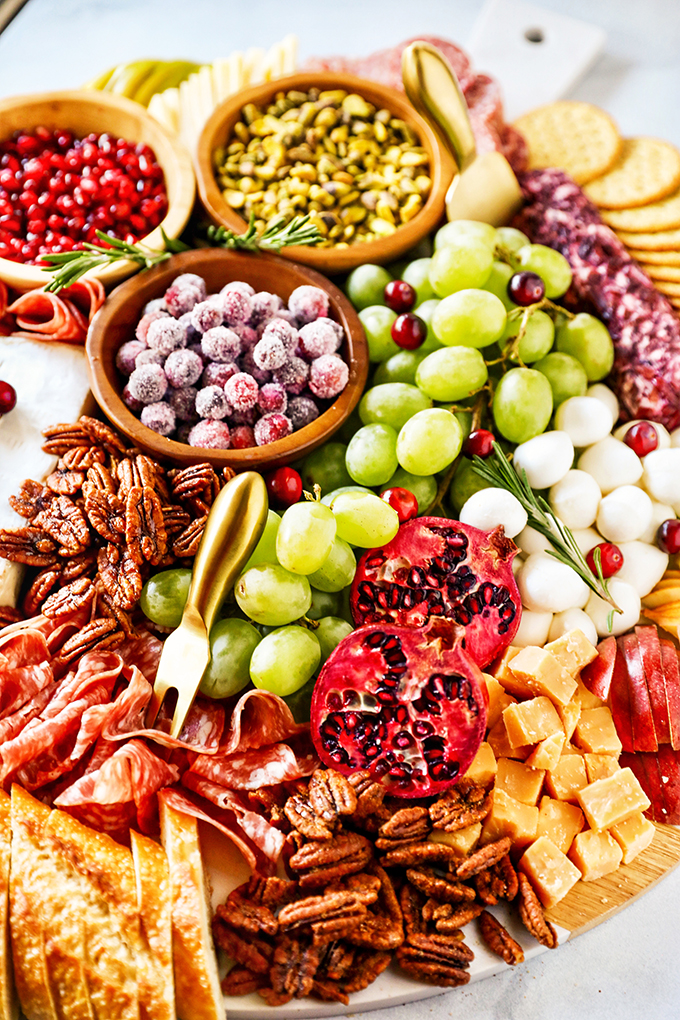 Festive Charcuterie Board with a variety of holiday-themed ingredients