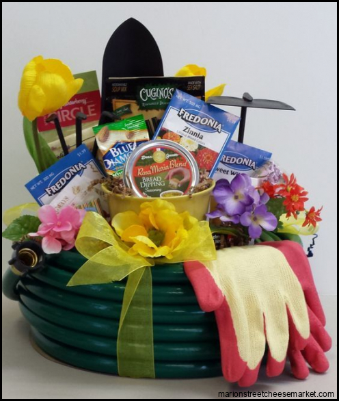This 60' Garden Hose Basket is filled with gardening goodies both for ...